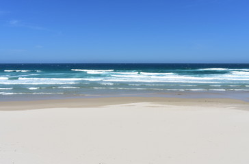 Fototapeta na wymiar Beach with white sand and wild sea with waves. Lugo, Spain.