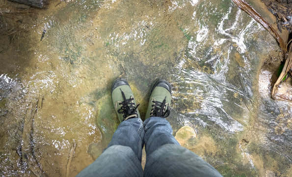 top view Foot in the water-rock