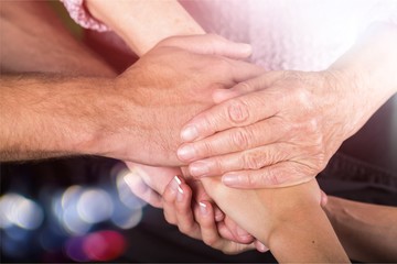 Man and Woman Hands Holding an Old Woman's Hands