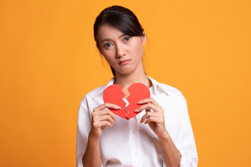 Beautiful young Asian woman with broken heart.