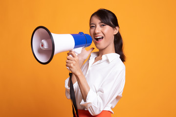 Beautiful young Asian woman announce with megaphone.