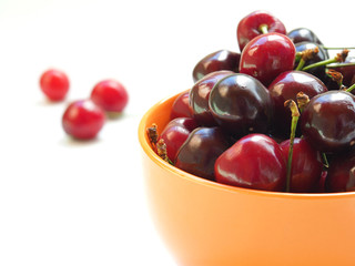 sweet cherry in a bowl on a light background