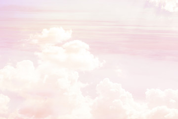 The abstraction is a sky of pink color and white clouds through which the sun's rays make their way