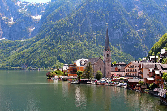 Famous Austria village Hallstatt with church and lake