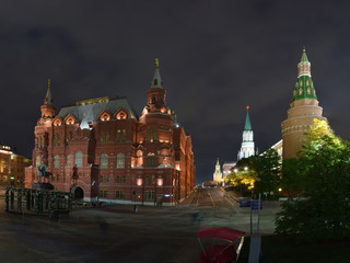 Fototapeta na wymiar Night view of the historical museum and the Kremlin Arsenal Tower from Manezh Square. Russia, Moscow, May 2019