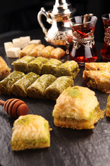 Middle eastern or arabic dishes. Turkish Dessert Baklava with pistachio on dishes