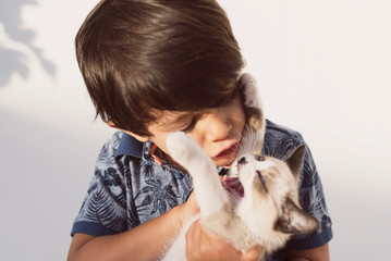 little children and pet puppy cat in outdoors image