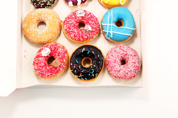 Fototapeta na wymiar donuts in different glazes with chocolate