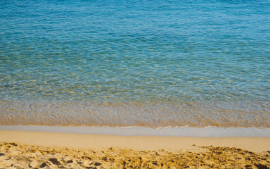 Beautiful calm sea on a empty relaxing sandy beach