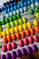 Abacus with colorful beads. Blurry background