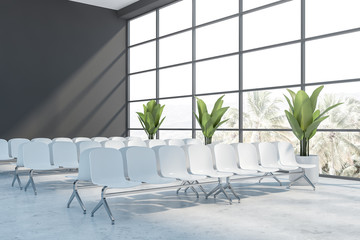 Empty gray airport terminal waiting area