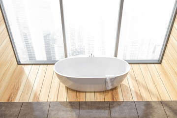 Top view of wooden floor bathroom with tub