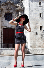Young attractive model in black dress at Plaza de la Catedral, Havana Vieja, Cuba