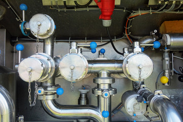 Fototapeta na wymiar Milk filling equipment in tank truck
