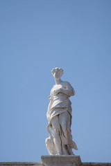 Statue in a row in St Mark's Square roof, Venice,march, 2019