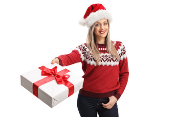 Young woman with a santa claus giving a present