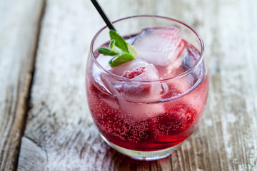Refreshing raspberry cocktail with ice