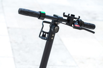 Modern сity transport - electric scooters is parked on the street of the city.