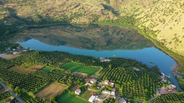 Aerial drone panoramic video of famous natural lake of Kournas with amazing colours and unique nature surrounded by mountains, Chania prefecture, Crete island, Greece