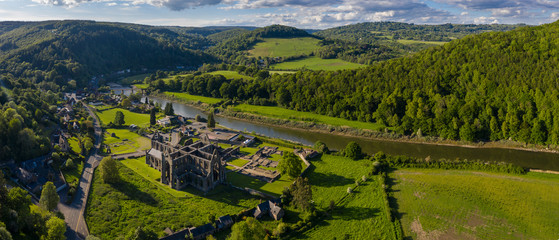 Aerial panoramic view of the ruins of Tintern Abbey, a Cistercian monastry located by the river Wye...