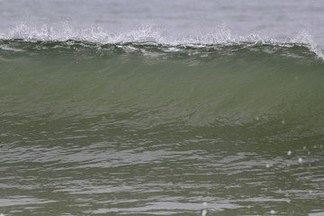 Ocean wave crashing on the beach