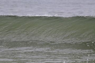 Ocean wave crashing on the beach