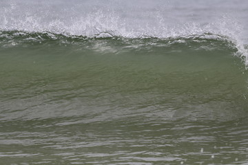 Ocean wave crashing on the beach