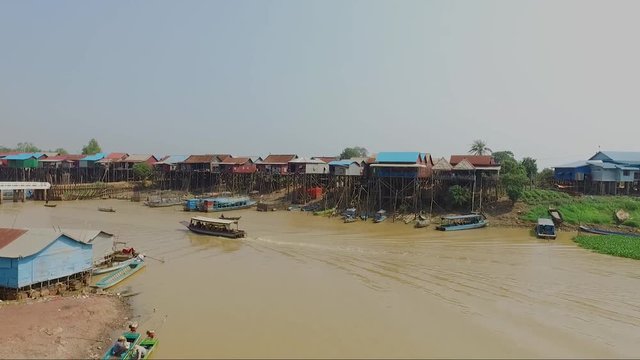 Aerial view of fishermen and the small village on the river bed of Mekong river.