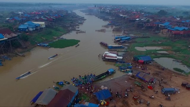 Aerial view of fishermen and the small village on the river bed of Mekong river.