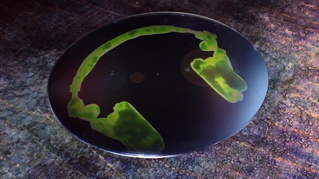 Head phones design toxic fumes silhouette motion on a shiny disk sitting on a grungy surface.