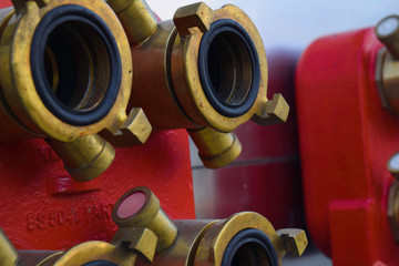 fire extinguisher connection to the station sprinkler system on the wall background