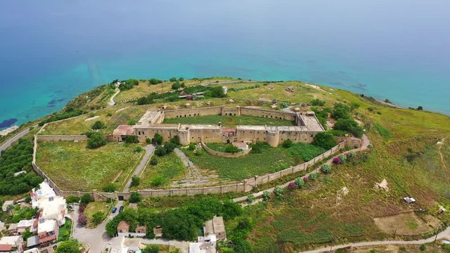 Aerial drone video of famous Ottoman fortified castle of Koule near ancient city of Aptera, Chania, Crete island