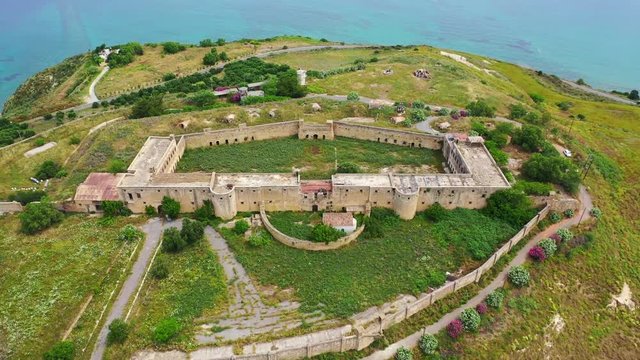 Aerial drone video of famous Ottoman fortified castle of Koule near ancient city of Aptera, Chania, Crete island