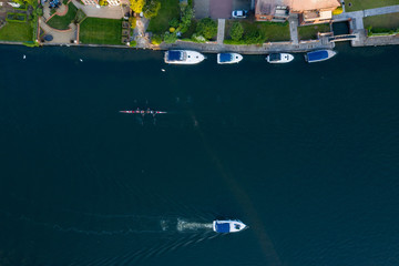 Aerial overhead view of rowers and pleasure boats on the river Thames in Marlow, Buckinghamshire, UK