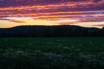 Obraz premium Sunset over a pasture in rural Alabama