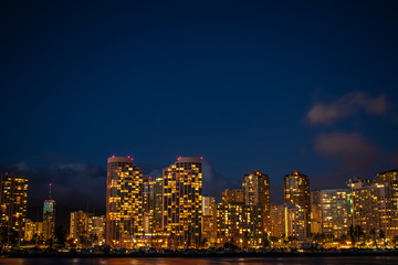 Fototapeta na wymiar Waikiki Skyline at Night in Honolulu, Hawaii