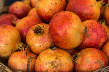 Close-up of box with many Italian pomegranates in fair