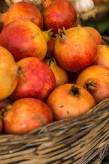 Close-up of box with many Italian pomegranates in fair