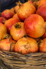 Close-up of box with many Italian pomegranates in fair
