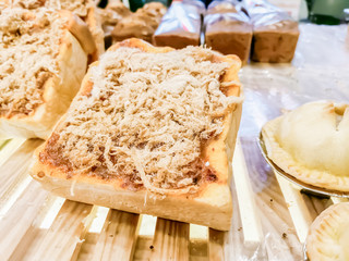 The bakery is sold in front of the candy shop in the department store.3