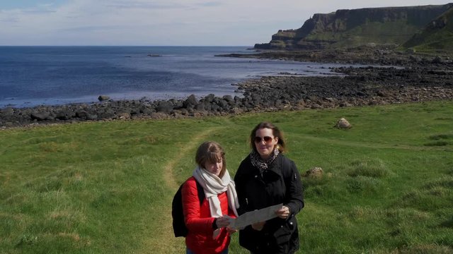 Two girls travel to Giants Causeway in Northern Ireland - travel photography