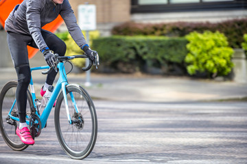 Cyclist in sportswear rides on the street on sports track bike