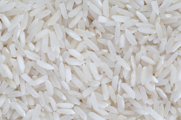 close up of uncooked rice grains background