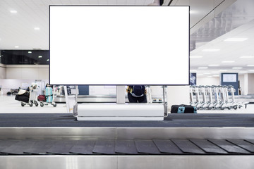 Blank advertising billboard at conveyor belt luggage in airportat airport. Copy space for cutomer text information advertise about tourism transport business etc.
