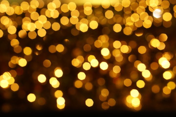 Abstract blurred and bokeh of party yellow LED reflection lighting on night time background.