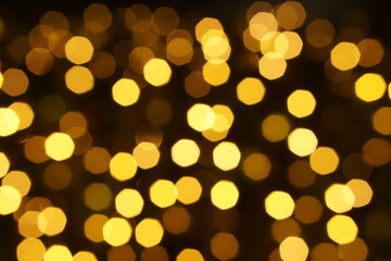 Abstract blurred and bokeh of party yellow LED reflection lighting on night time background.