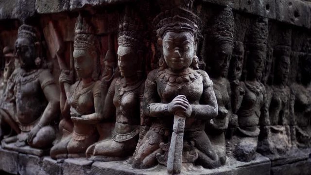 Close view of amazingly detailed bas-reliefs of the Leper King terrace located in the northwest corner of the Royal Square of Angkor Thom, Cambodia.