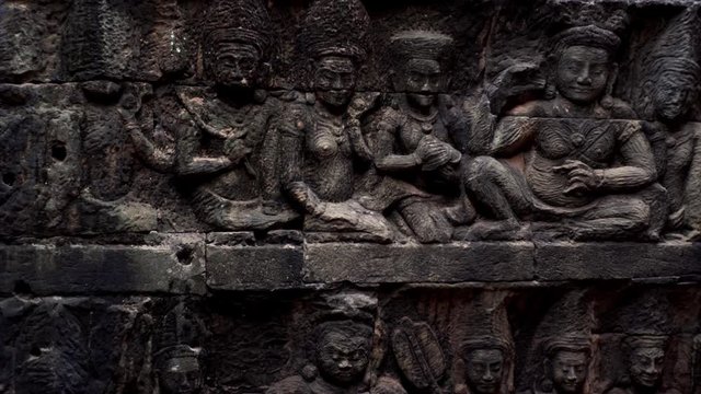 Ancient bas-reliefs on brick of the Terrace of the Leper King terrace in the northwest corner of the Royal Square of Angkor Thom, Cambodia.