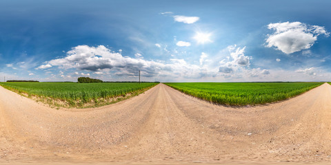 full seamless spherical hdri panorama 360 degrees angle view on gravel road among fields in summer...