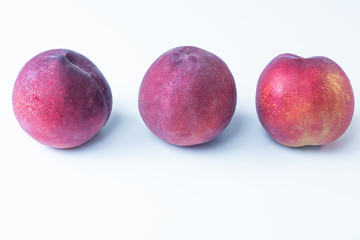Nectarines. Just harvested organic nectarines on white Background